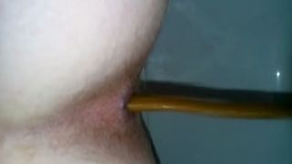 Shaved babe shitting