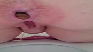 Mature babe shits over toilet