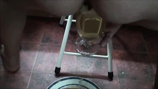 Mature lady shit a big load of diarrhea and piss on glass