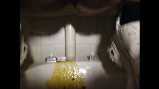 Constipate girl shitting a big load of liquid shit on the wc