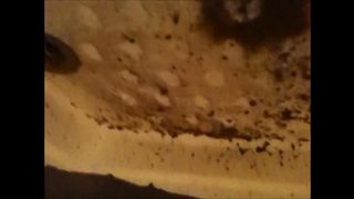 Woman shitting a very liquid diarrhea in the shower