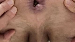 Gay guy stretches ass and shits
