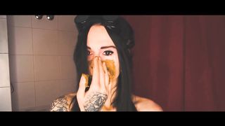 Russian girl smears shit on her pretty face