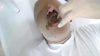 Feeding chubby slave with shit
