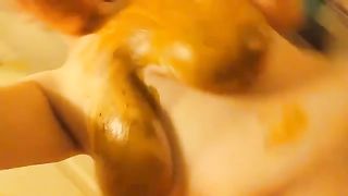 Rubbing shit on big tits