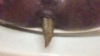 Ebony girl pooping in close up