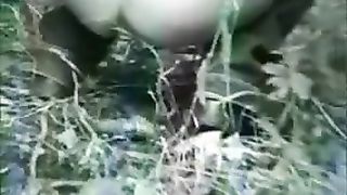 Two hot girls poop in a forest