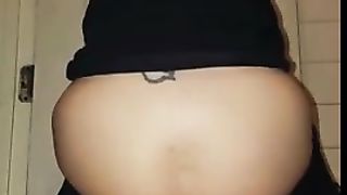 Tattooed girl shits on white plate