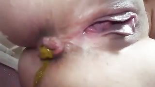 Close up of teen shitting slowly and hard