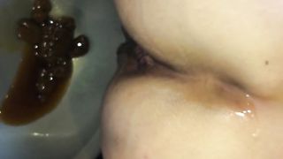 Japanese beauty pooping in a bowl