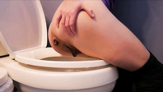 Pushing big turds from her ass