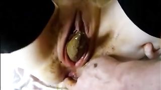 Dirty lady eject a piece of shit from her cunt