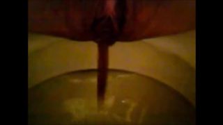 Girl shitting in the toilet and inserting dildo on her asshole