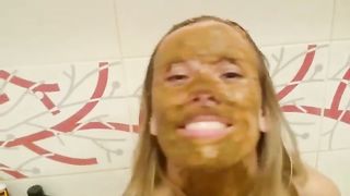 Rubbing brown shit on big tits