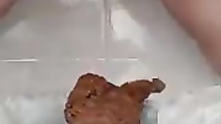 Chubby babe shitting a lot slowly