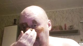Bald dude rubbing shit all over his face