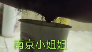 Chinese lady poops in the paper cup