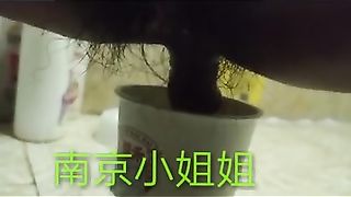 Chinese lady poops in the paper cup
