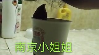 Chinese lady poops in the paper cup