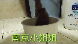 Chinese lady poops in the paper cup