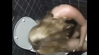 Amateur blonde lady pooping in the toilet