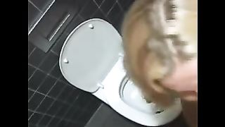 Amateur blonde lady pooping in the toilet