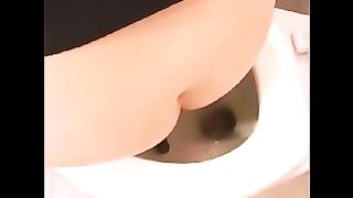 Blonde babe drops a nice shit into a toilet