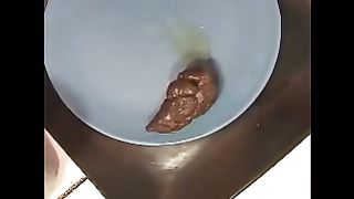 Beautiful brunette chick pooping in hot closeup