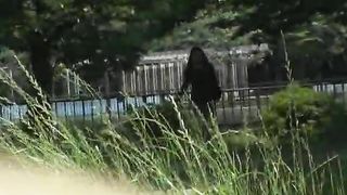 Shameless babe poops in the grass