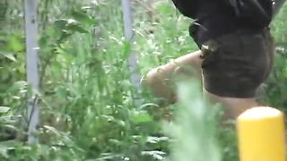 City girl poops in the bushes