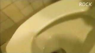 Naughty hot brunette chick pooping in toilet