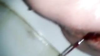 Closeup of lady in her periods pooping