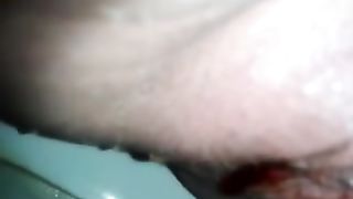 Closeup of lady in her periods pooping