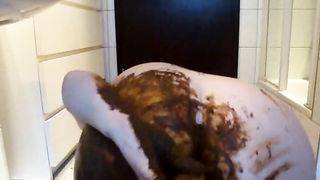 Seductive bitch smearing poop in solo