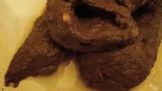 Dark brown turd closeup video