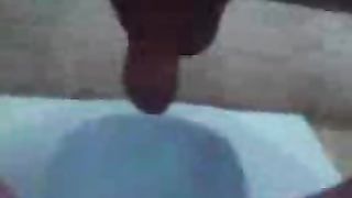 Guy pooping in the toilet