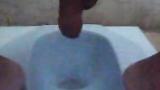 Guy pooping in the toilet