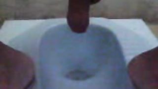 Guy pooping in the toilet