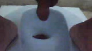 Guy pooping in the toilet