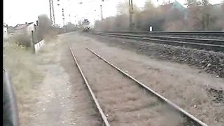Lady shitting and pissing on a train track