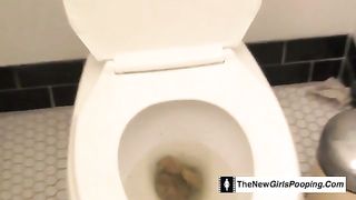 Beautiful brunette chick pooping in the toilet