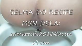 Naked brunette babe poops