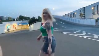 Tattooed blonde babe pooping in the car park