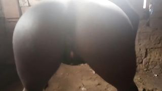African slut poops in an abandoned building