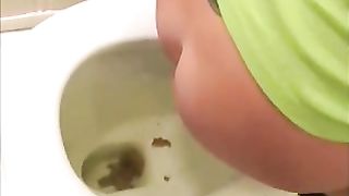 Sexy brunette amateur lady pooping while smiling