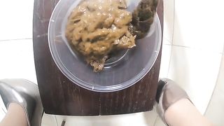 Chinese maid filling bowl with creamy poop