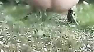 Slutty girl pooping in the woods and bushes