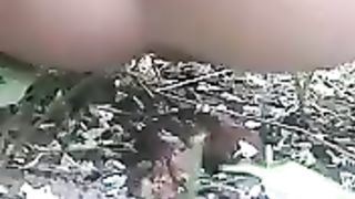 Slutty girl pooping in the woods and bushes