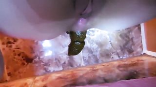 Big dark black poop on the floor