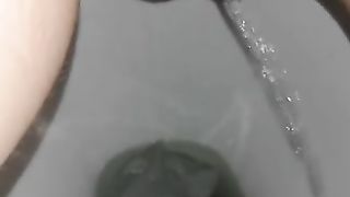 Shaved pussy wife spread legs and pissing in closeup